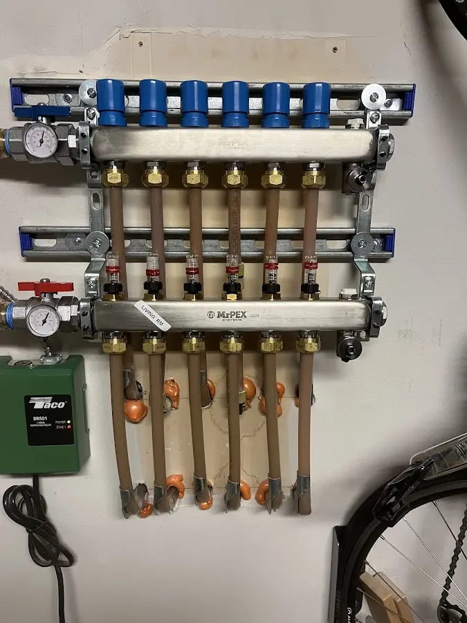 Plumber performing Water Heater Repair at a residential property in Goshen